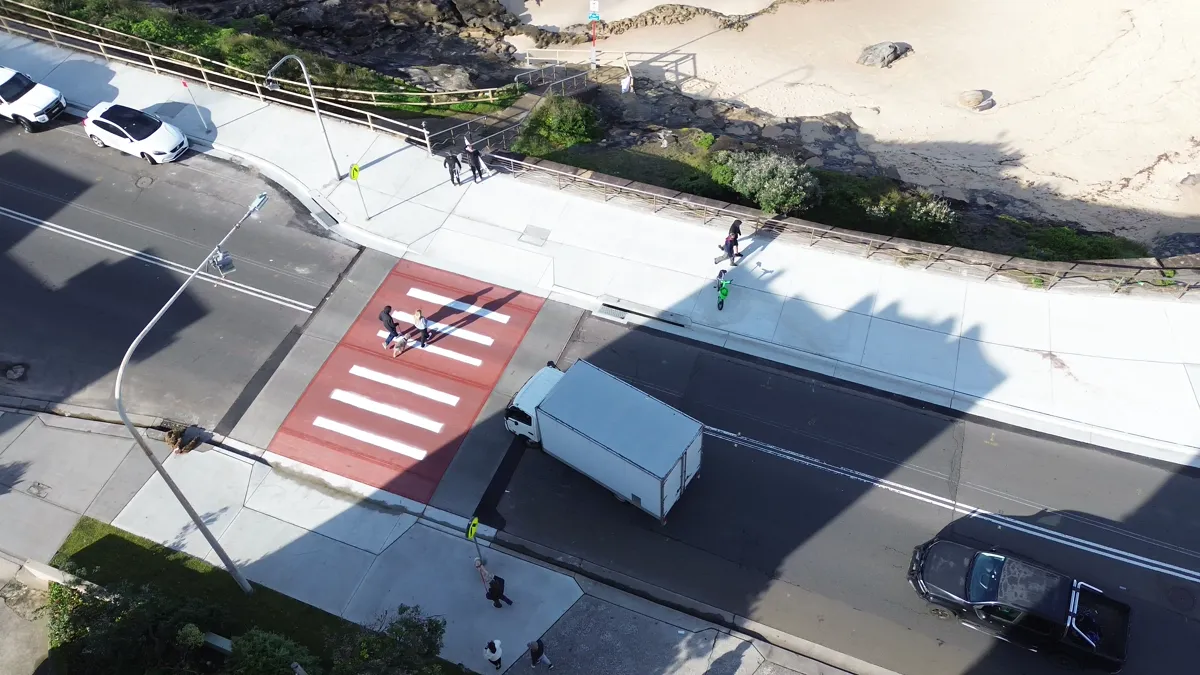 VV Move & Go removalist truck at a pedestrian crossing in Maroubra